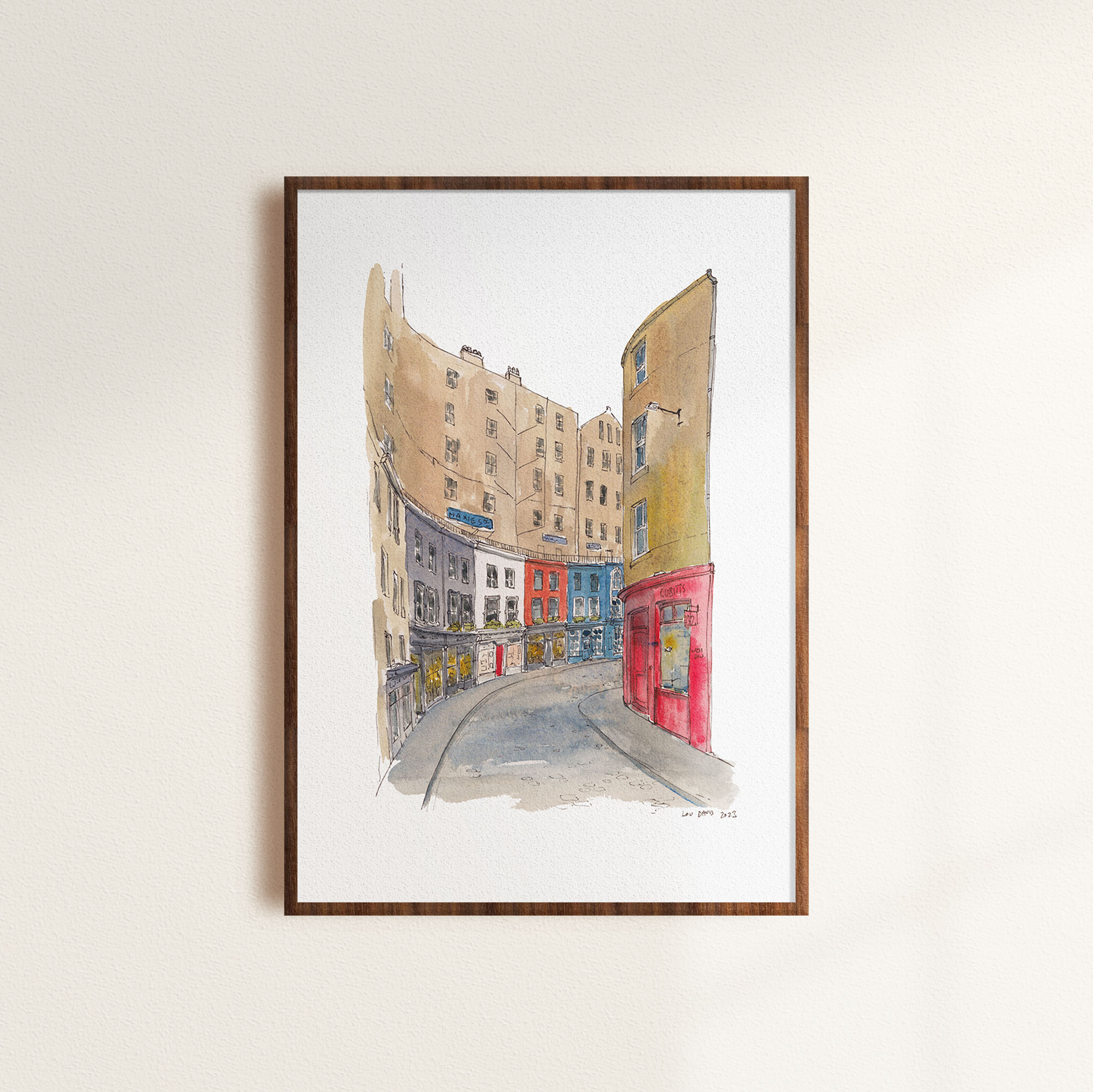 A line and wash painting of Victoria Street in a mockup frame